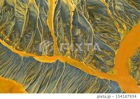 Aerial view of surreal toxic water stream from copper mine in decanting lake. Natural pattern Aerial view of surreal toxic water stream from copper mine in decanting lake. Natural pattern 134187934