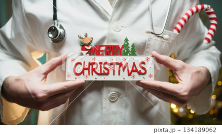 Merry Christmas Wishes Text From a Doctor in Hospital in Front of Tree Merry Christmas Wishes Text From a Doctor in Hospital in Front of Tree 134189062