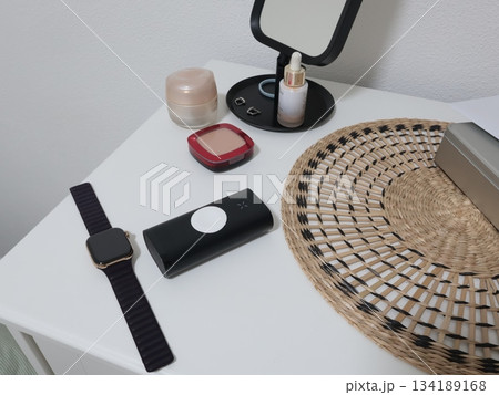Power bank for smartwatch on desk in room. Innovation and smart technology. 134189168