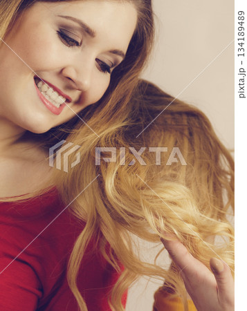 Girl looking on hair ombre color Girl looking on hair ombre color 134189489