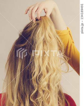 Two girls creating hairdo. Hair ombre color Two girls creating hairdo. Hair ombre color 134189491