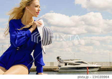 Fashion model wearing blue jumpsuit Fashion model wearing blue jumpsuit 134189964