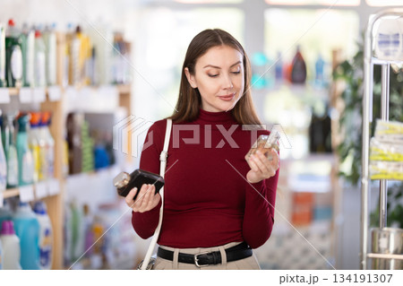 Young woman choosing perfume 134191307