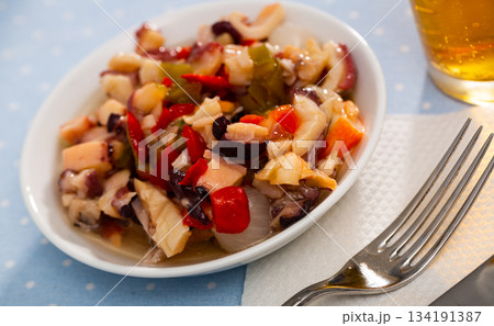 Delicious salad from variety of seafood with chopped vegetables (Salpicon de mariscos) typical for Spanish cuisine Delicious salad from variety of seafood with chopped vegetables (Salpicon de mariscos) typical for Spanish cuisine 134191387