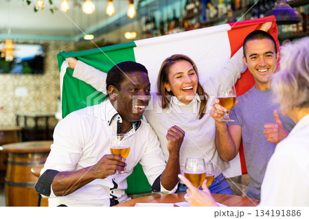 Happy fans celebrating the victory of Italian team in bar 134191886