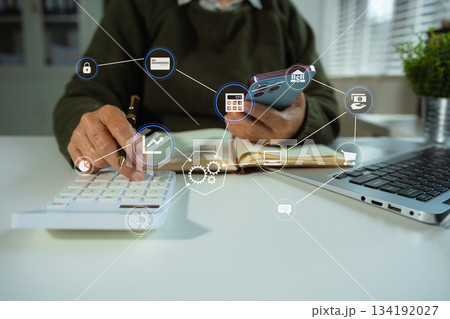 Business women using calculator with computer laptop, Business accounting, budget and loan paper in office. 134192027