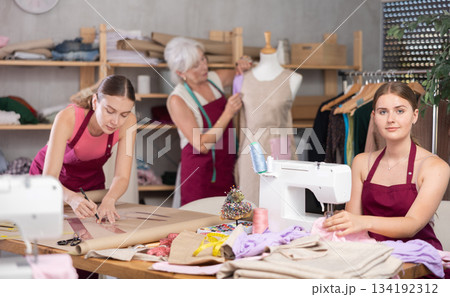 team of female seamstresses works in the atelier team of female seamstresses works in the atelier 134192312