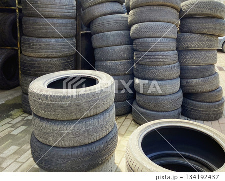 Pile of old used car tires outdoors Pile of old used car tires outdoors 134192437