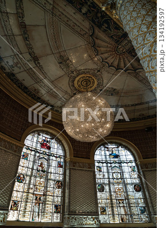 View of The Gamble Room with the walls and large columns were covered in a variety of colourful ceramic tiles, The ceiling was decorated in enamelled iron sheets, Stained-glass windows and pendant 134192597