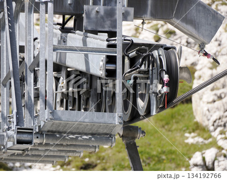 Chairlift in dolomites detail, summer season Chairlift in dolomites detail, summer season 134192766