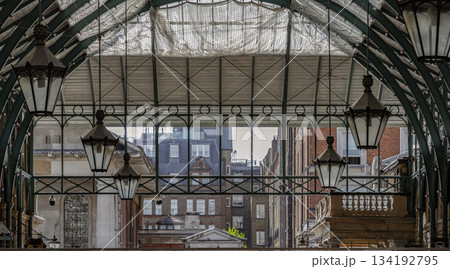 Architecture greco-roman style with iron glass roof and Lanterns hanging on the ceiling in Covent Garden. Architecture greco-roman style with iron glass roof and Lanterns hanging on the ceiling in Covent Garden. 134192795