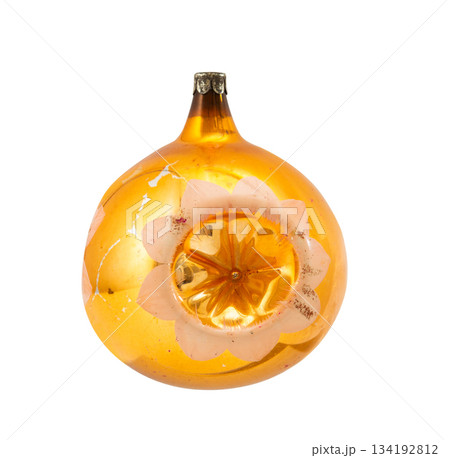 Vintage golden glass Christmas ornament with pink indented star flower on a white background. USSR New Year's decor. 134192812