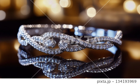 Elegant diamond-encrusted bracelet showcased with beautiful reflections in an upscale setting Elegant diamond-encrusted bracelet showcased with beautiful reflections in an upscale setting 134193969