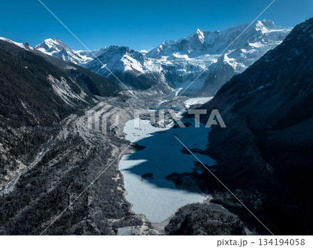 Aerial view of beautiful hanging glacier and lake  in high altitude mountains landscape 134194058