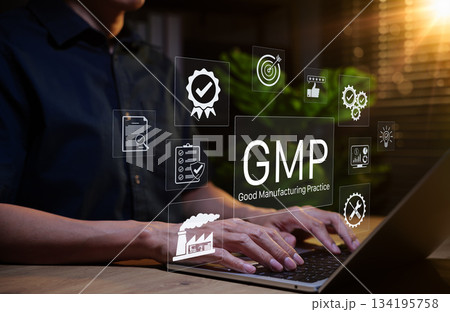 Good Manufacturing Practice (GMP) Concept. Businessman working on laptop with icons representing compliance, quality control, assurance, certification, factory standards, certified process management, Good Manufacturing Practice (GMP) Concept. Businessman working on laptop with icons representing compliance, quality control, assurance, certification, factory standards, certified process management, 134195758