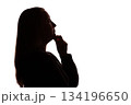Silhouette of young woman touching her chin thoughtfully, white background 134196650