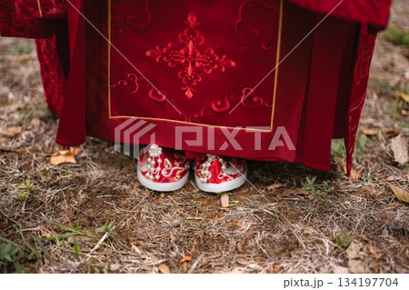 Celebrating Chinese wedding tradition with bride's red shoes 134197704