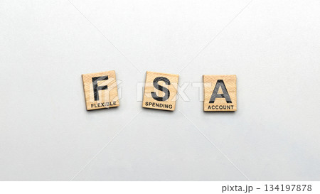 Wooden tiles with letters spelling out Flexible Spending Account on a clean white background. Concept of FSA (Flexible Spending Account) Wooden tiles with letters spelling out Flexible Spending Account on a clean white background. Concept of FSA (Flexible Spending Account) 134197878