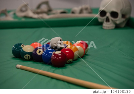 spooky halloween decor aound billiards pool table 134198159