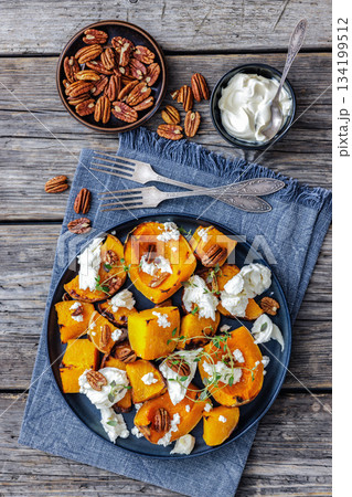 baked butternut squash with cheese, thyme, pecan baked butternut squash with cheese, thyme, pecan 134199512