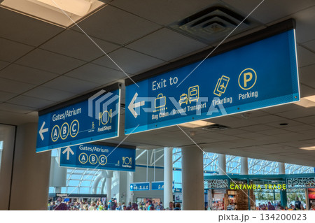 Charlotte, NC, USA, August 28, 2025: walk through a bright and spacious concourse at Charlotte Douglas International Airport 134200023