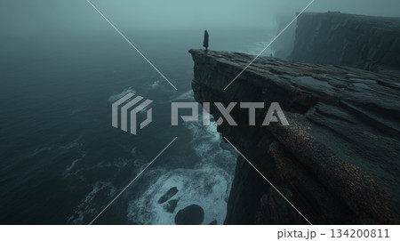 Lone figure standing on a cliff edge facing a...のイラスト素材 [134200811] - PIXTA