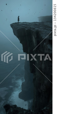 Lone figure standing on a cliff edge facing a dark, misty sea. Figure on a cliff overlooking waves in a gloomy, mysterious, and atmospheric landscape Lone figure standing on a cliff edge facing a dark, misty sea. Figure on a cliff overlooking waves in a gloomy, mysterious, and atmospheric landscape 134200815