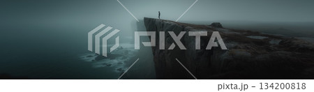 Lone figure standing on a cliff edge facing a...のイラスト素材 [134200818] - PIXTA