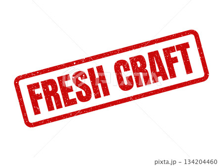 Distressed red rubber stamp with the words FRESH CRAFT centered in a bold font angled for visual impact Distressed red rubber stamp with the words FRESH CRAFT centered in a bold font angled for visual impact 134204460