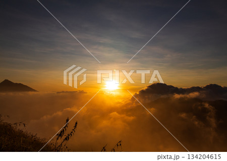 Sunrise over the mountain with expanse of clouds on Mount Anak Dara, Lombok, Indonesia Sunrise over the mountain with expanse of clouds on Mount Anak Dara, Lombok, Indonesia 134204615