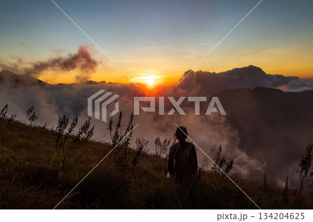 Sunrise over the mountain with expanse of clouds on Mount Anak Dara, Lombok, Indonesia Sunrise over the mountain with expanse of clouds on Mount Anak Dara, Lombok, Indonesia 134204625