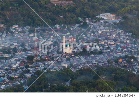 Lombok Sembalun Mosque towering over houses, high angle view 134204647