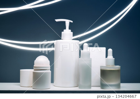 Skincare product bottles with serum and light painting Skincare product bottles with serum and light painting 134204667