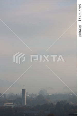 Cloudy sky with a tall building in the background Cloudy sky with a tall building in the background 134207769