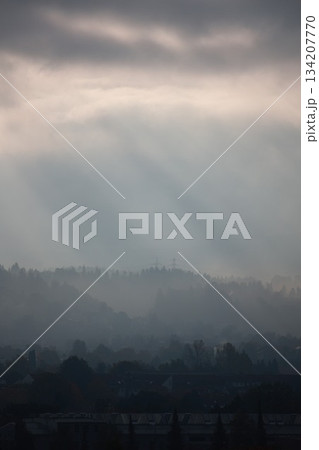 The sky is cloudy and the sun is shining through the clouds The sky is cloudy and the sun is shining through the clouds 134207770