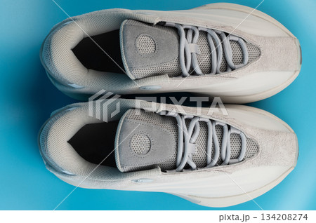New sneakers display on a blue background with soft lighting 134208274