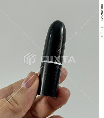 Black Lipstick Tube in Hand Black Lipstick Tube in Hand 134208406
