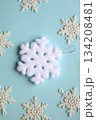 White snowflakes on a blue background. 134208481