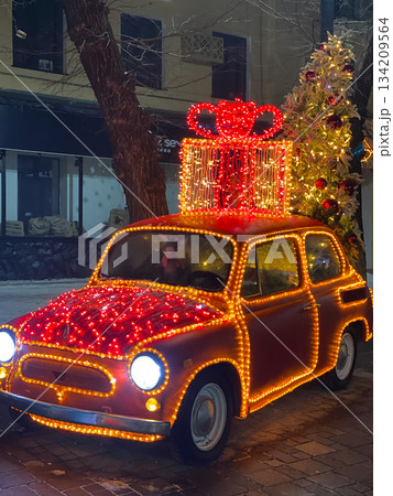 Festive Car Decorated With Christmas Lights Festive Car Decorated With Christmas Lights 134209564