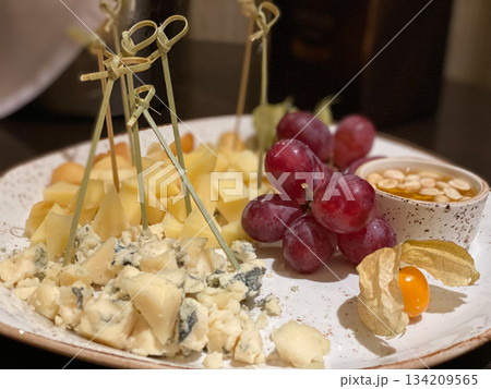 Cheese Plate with Grapes and Honey Cheese Plate with Grapes and Honey 134209565
