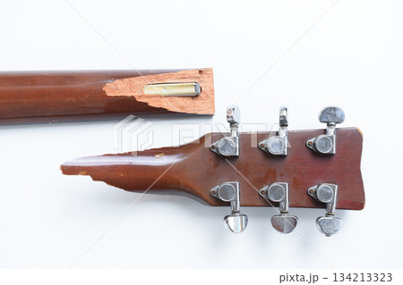 part of broken wood acoustic guitar isolated on white background 134213323