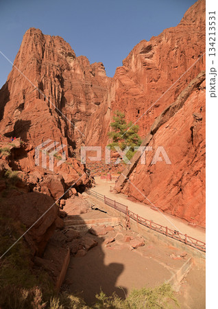 The Tianshan Grand Canyon, or Kesileya Grand Canyon, is a stunning natural feature in Xinjiang, China characterized by its distinctive red canyons formed by millions of years of wind and rain erosion. The Tianshan Grand Canyon, or Kesileya Grand Canyon, is a stunning natural feature in Xinjiang, China characterized by its distinctive red canyons formed by millions of years of wind and rain erosion. 134213531