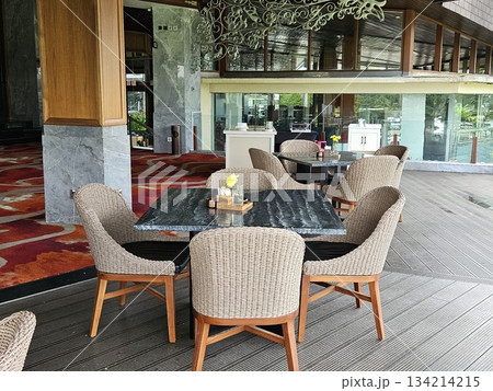this is chair and table at a restaurant. 134214215
