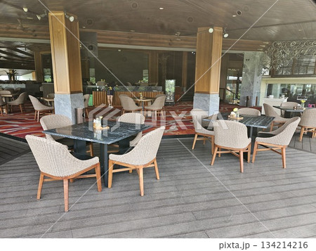this is chair and table at a restaurant. 134214216