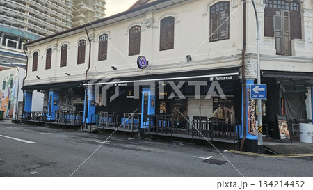 A heritage shophouse from 1927 with arched windows A heritage shophouse from 1927 with arched windows 134214452
