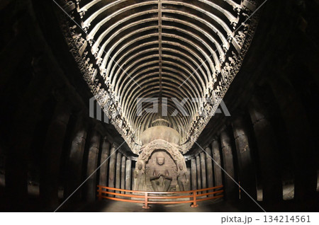 Buddha statue in Cave No.10 of the Buddhist temple at Ellora Caves. Elora a UNESCO World Heritage Site, is one of the world's largest collections of rock-cut temples and shrines. 134214561