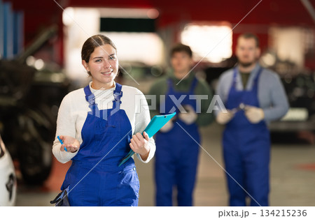 young woman worker invites to the services of a car service 134215236