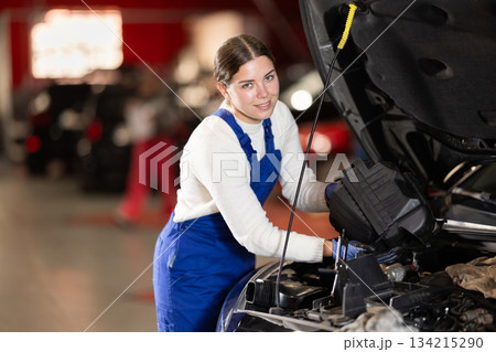 female mechanic inspects the car 134215290