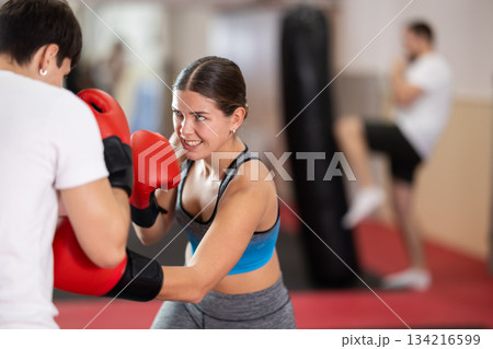 Woman sparring in boxing 134216599