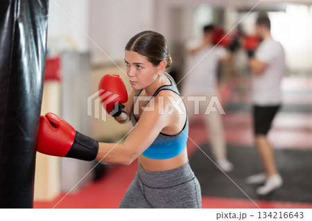 Woman training in boxing section Woman training in boxing section 134216643
